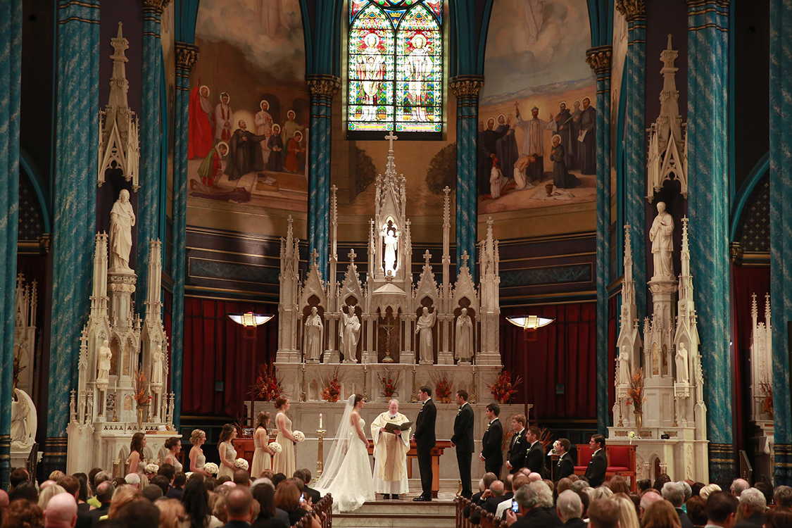 Wedding Ceremony at St. Francis Xavier Church, Cincinnati, Ohio. Flowers by Floral Verde LLC. Photo by Sherri Barber.