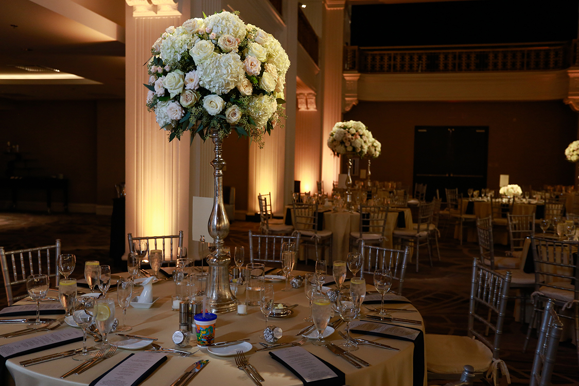 Wedding Reception with tall centerpieces at The Renaissance, Cincinnati, Ohio. Flowers by Floral Verde LLC. Photo by Sherri Barber.