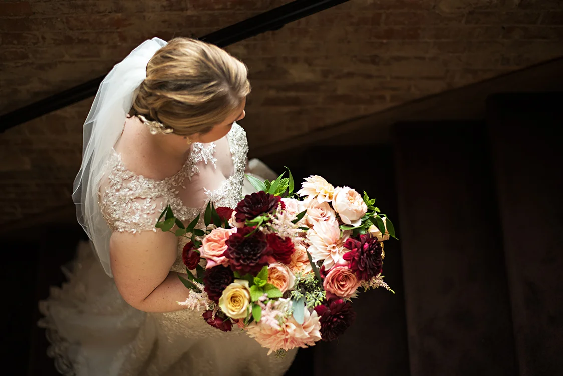 Wedding at The Monastery Event Center in Cincinnati, Ohio. Flowers by Floral Verde. Photo by Parisi Images.