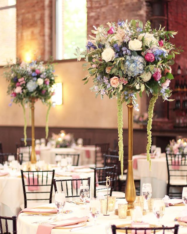 Kaitlin and Ben's ceremony arrangements were repurposed to the tables for the reception.