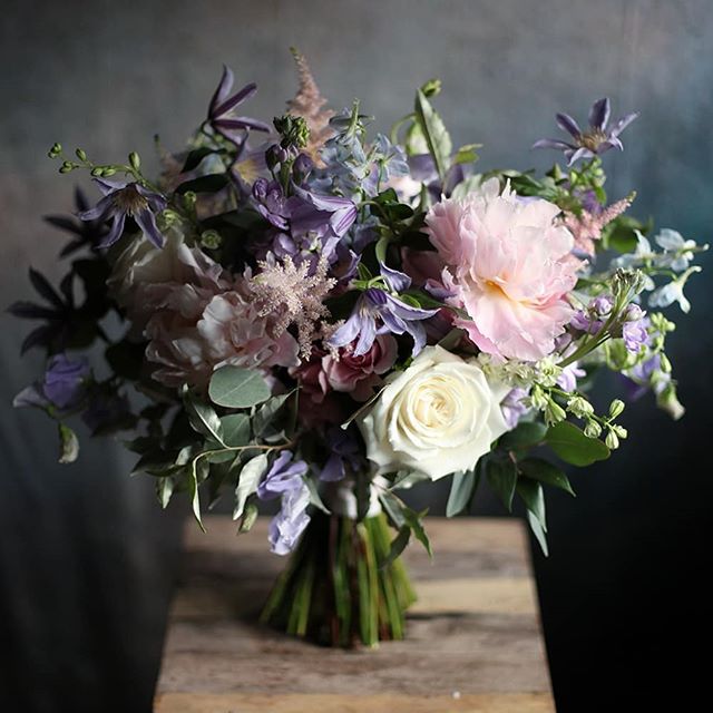 The bridal bouquet from last weekend's wedding at the @monasteryeventcenter, full of sweet peas, clematis, astilbe, and peonies. Congratulations to Kaitlin and Ben! 💕