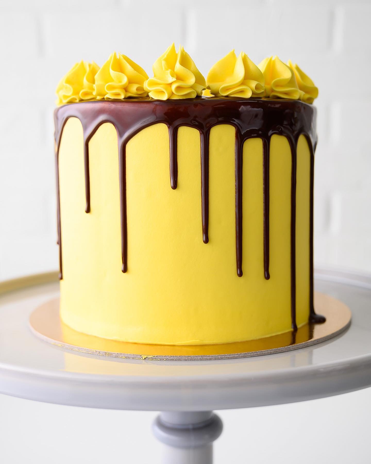 6&rdquo; Chocolate Drip Cake in Yellow 🍫💦🎂💛 See all our flavors, designs, and colors at the Made-to-Order Cake link in bio.