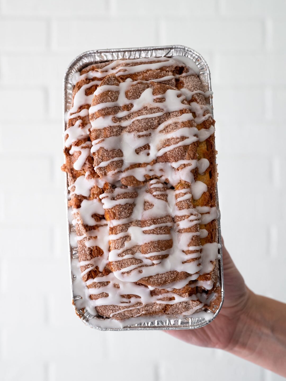 NEW GLAZED CINNAMON BREAD ☁️🍞🎄 Like a cinnamon roll and a cake had a baby. Soft quick bread swirled with cinnamon sugar, topped with more cinnamon sugar and vanilla glaze. Get it by preorder at the Christmas Menu in bio, or in store starting Friday