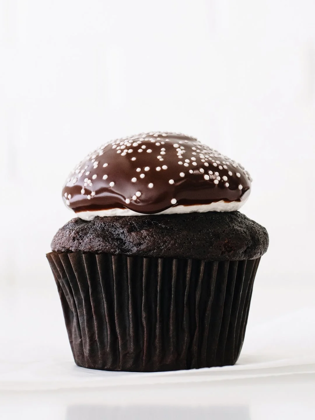 Back to our regularly scheduled sugar programming tomorrow. Also, this is your last week to get Snowcap Cupcakes ☃️🌨️❄️ Chocolate cake, vanilla cream icing, chocolate ganache, and nonpareils. Here and @suarezbakeryandbarra till sold out every day th