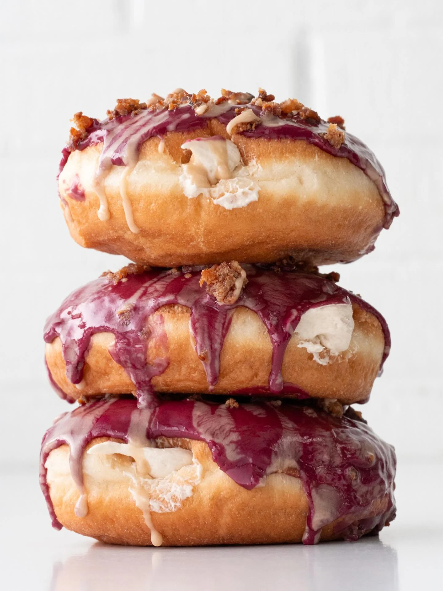 ICYMI: Blueberry Bacon Pancake Doughnuts are on deck 🫐🥓🥞🍩 Maple cake batter cream filling, blueberry glaze, bacon pieces, maple drizzle. Here and @suarezbakeryandbarra for a limited time.

#charlotte #doughnuts #blueberrypancakes