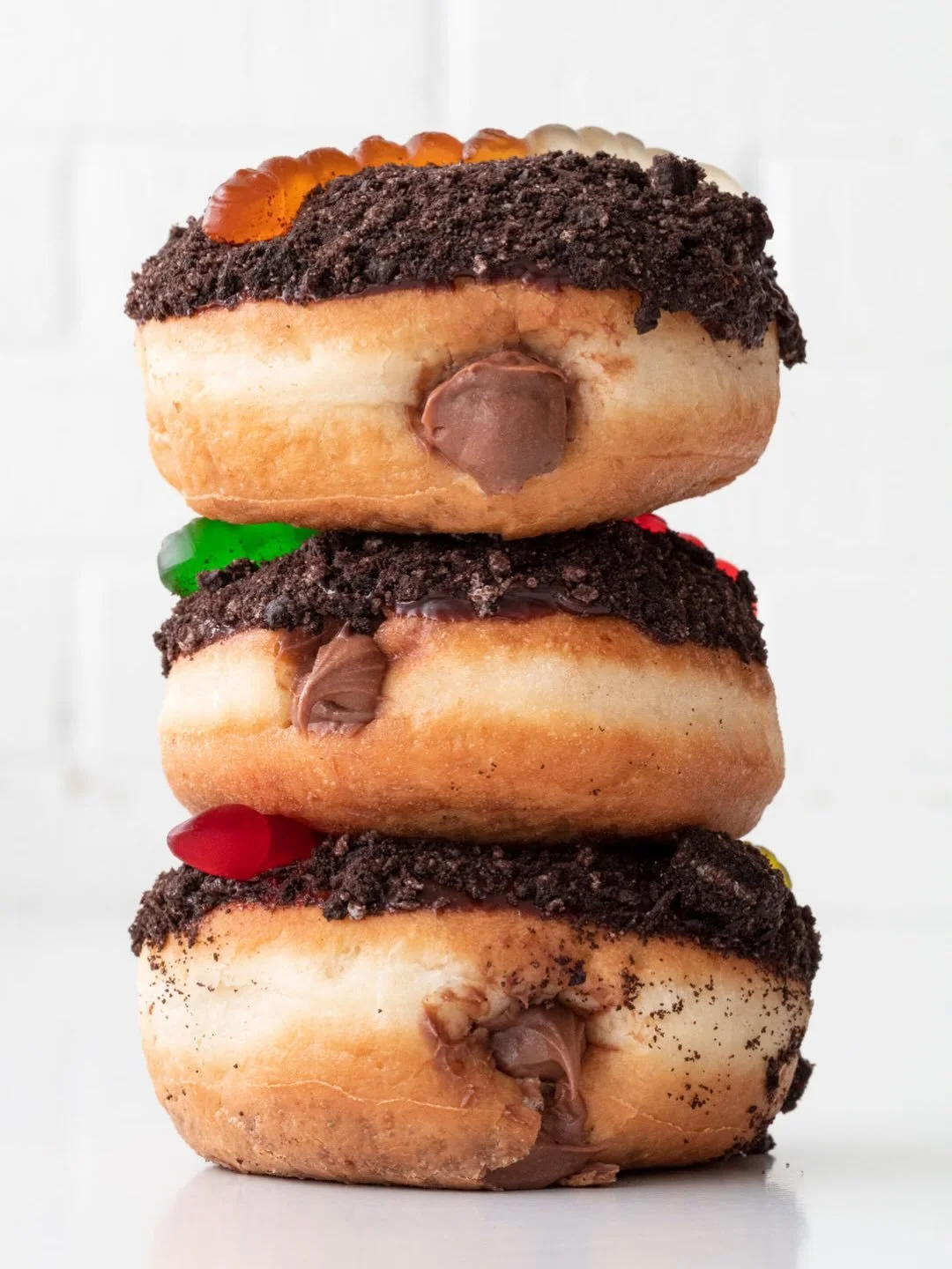 This is the last week for Dirt Doughnuts 🪱🍫 Fluffy yeast doughnuts filled with chocolate custard, topped with chocolate ganache and crushed Oreos, and finished with a gummy worm. Decomposing never tasted so good. Here only through Halloween.

#char