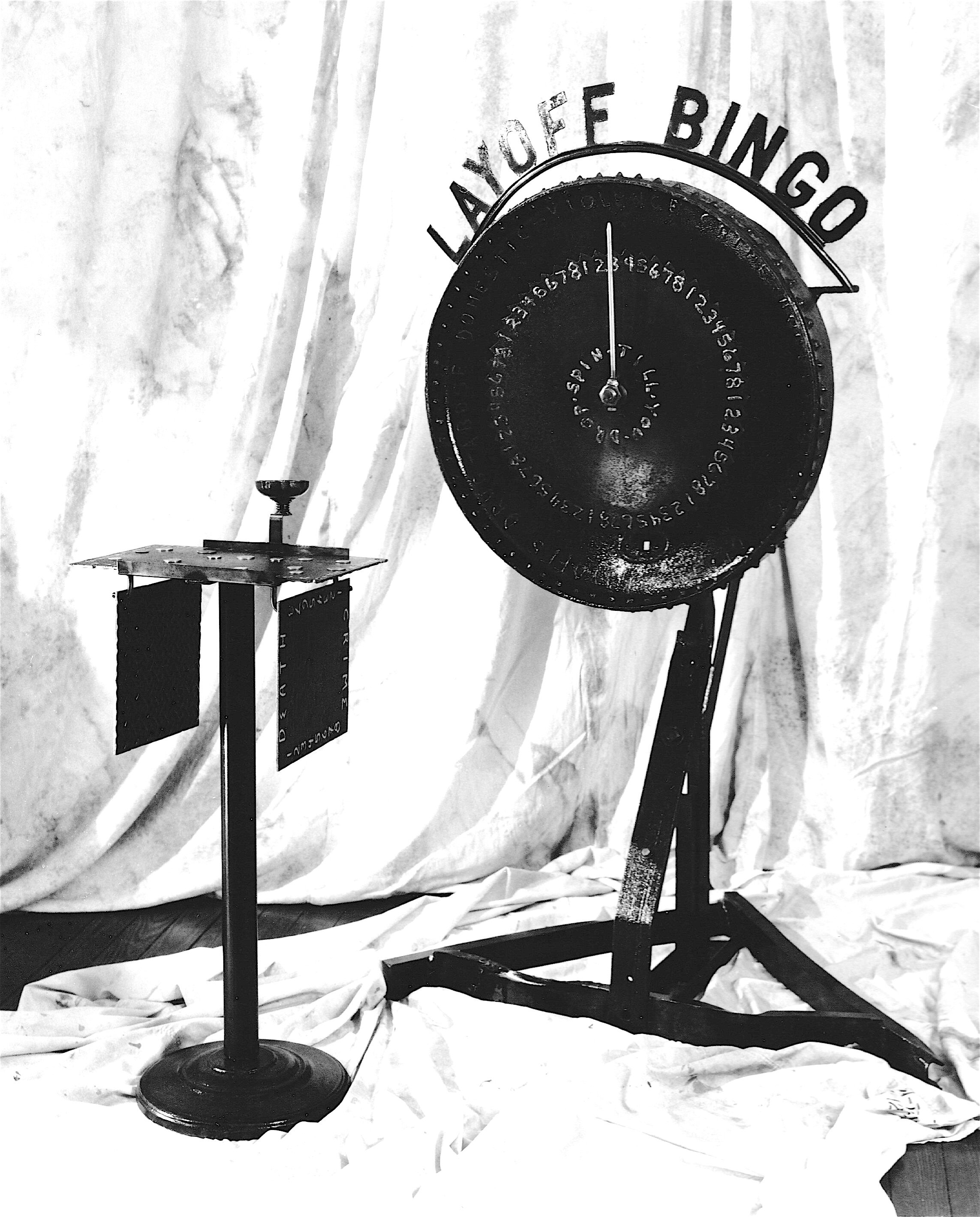 Layoff Bingo. 70"h. x 43"l. x 46"d. welded steel with oil finish. 1993