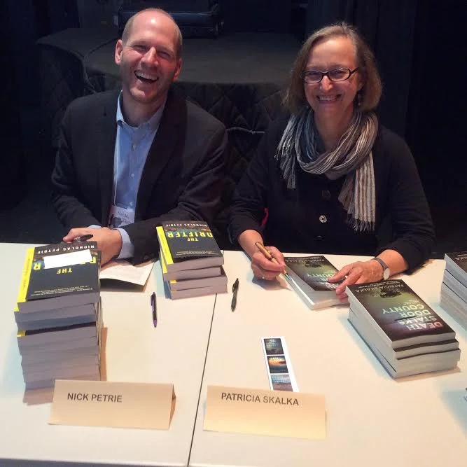 Signing books at the 2016 Washington Island Literary Festival, with author Nicholas Petrie.