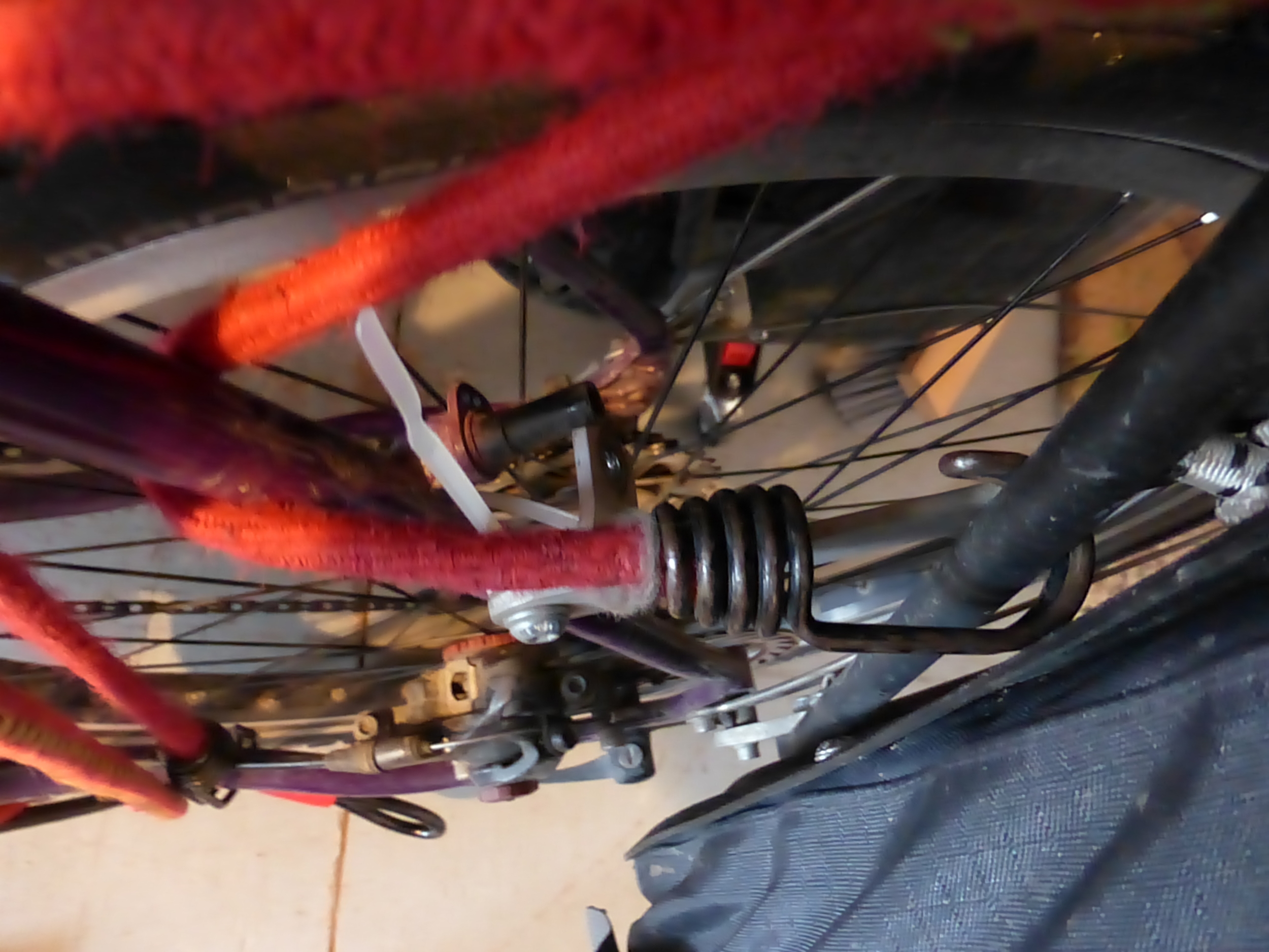 Want to see a magic trick? I had a bolt in there. POOF. Now its gone. I've been riding like that for who knows how many kilometers. The Old Man Mountain racks rock! You can imagine what kind of vibrations it takes to unscrew a brake bolt.