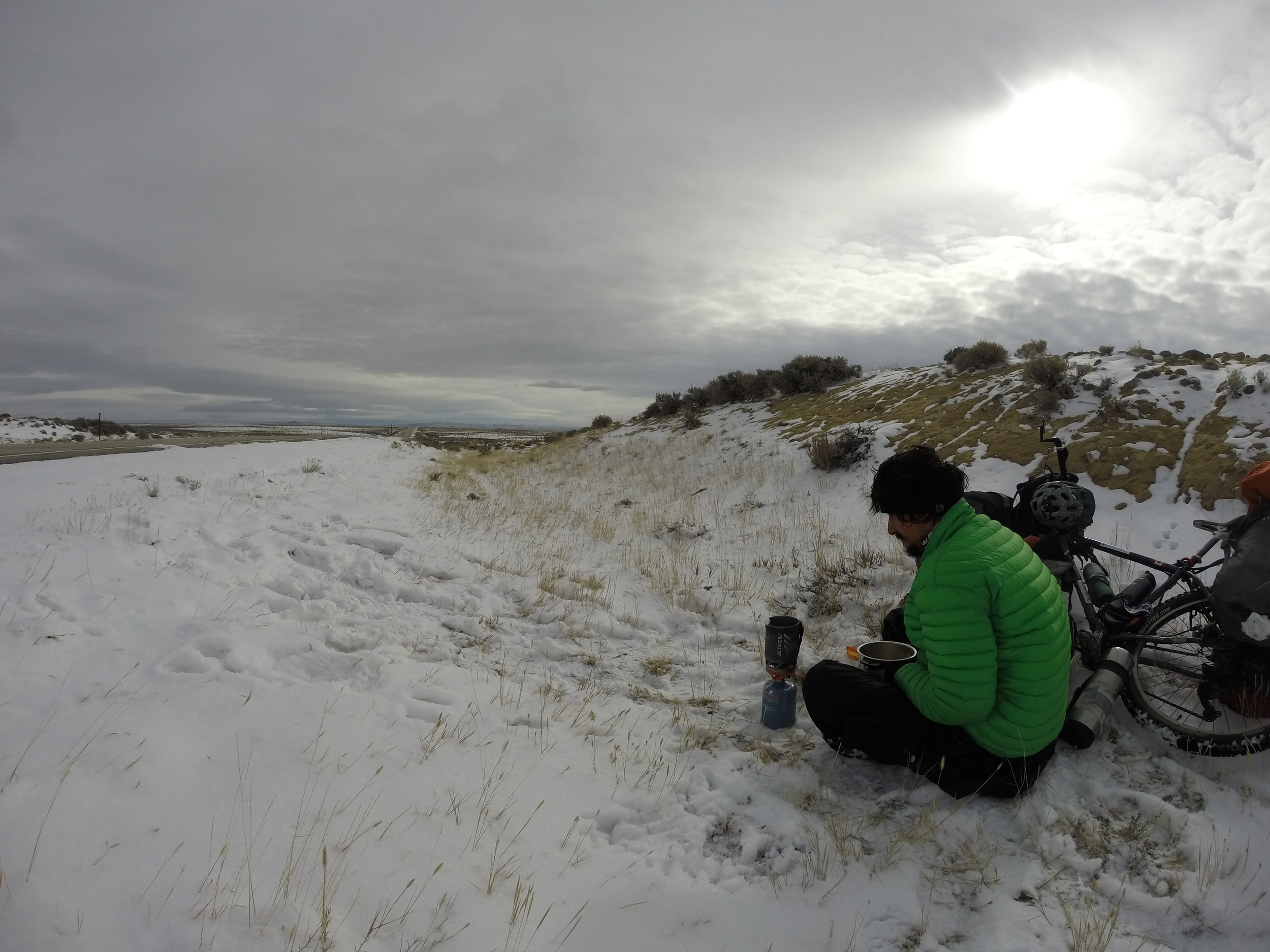 The ditch was the only place offering some cover from the wind. I stopped to melt snow for lunch & drinking water.