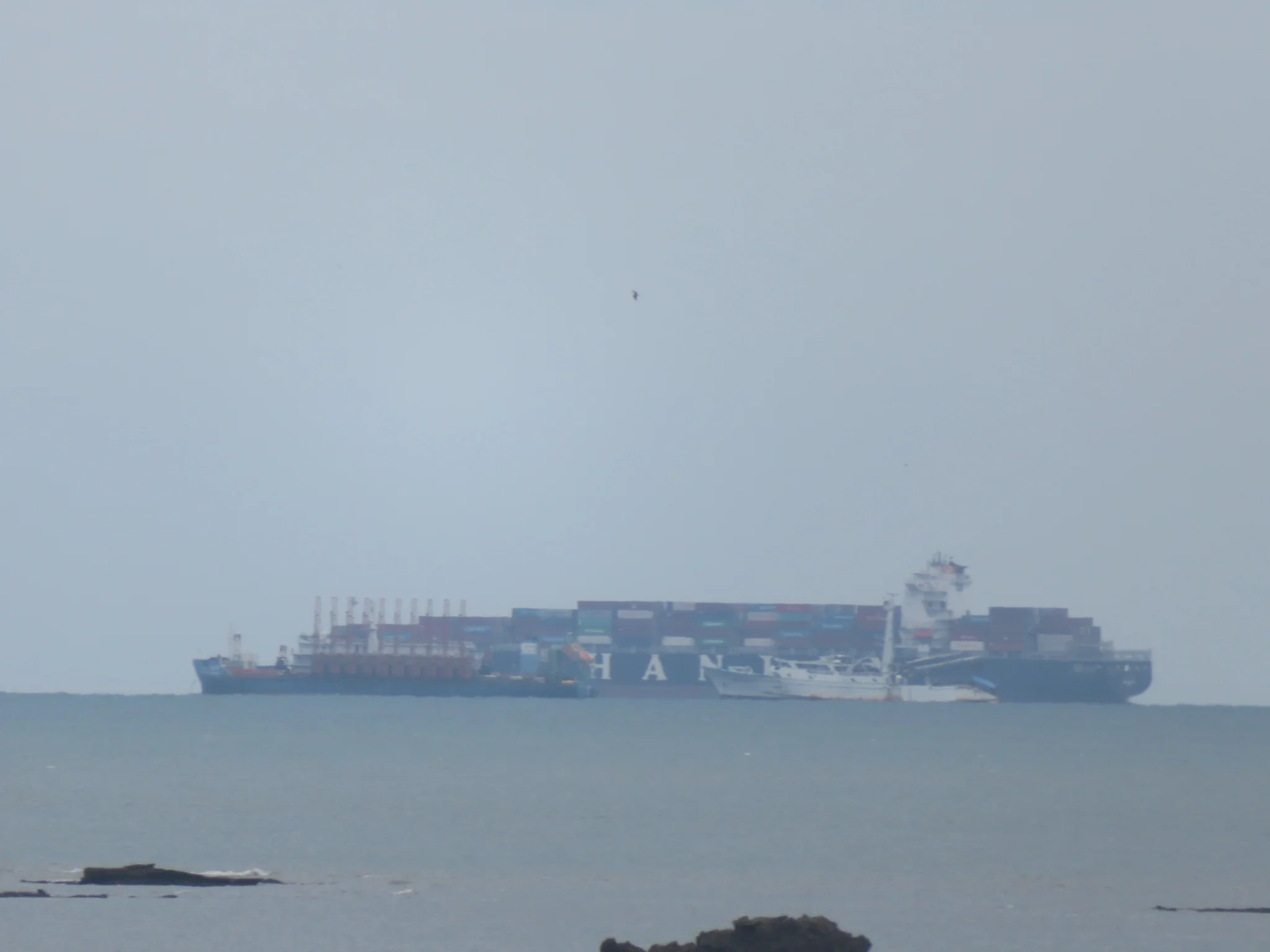 Nope... that's not an island. Note the "smaller" ship unloading this giant ball of steel and "made in china" stickers!