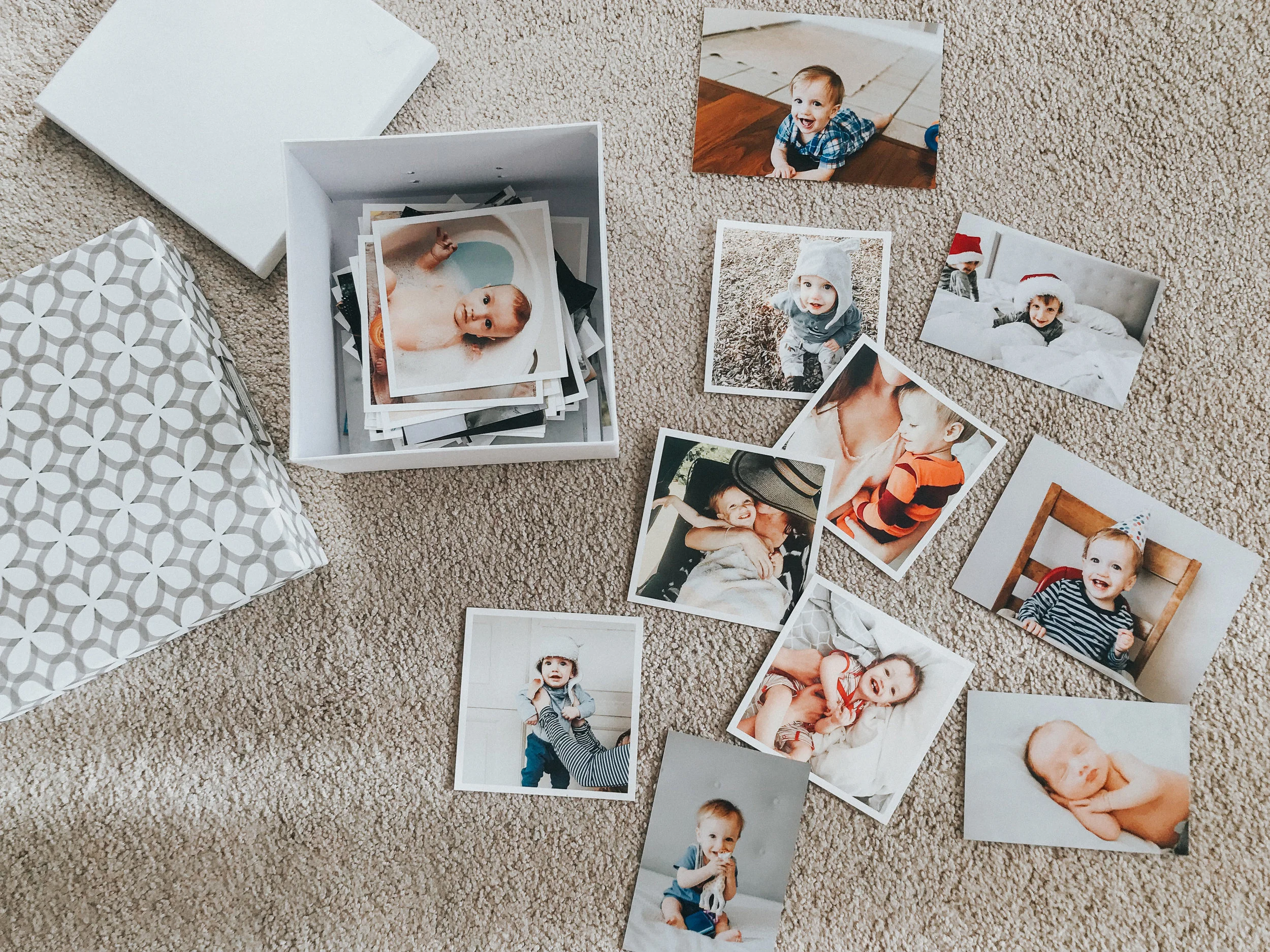 Usually on my kids' birthdays, I order prints of them from the past year and hang them around the house as "birthday banners" - then put the leftovers in this little box for safekeeping. 