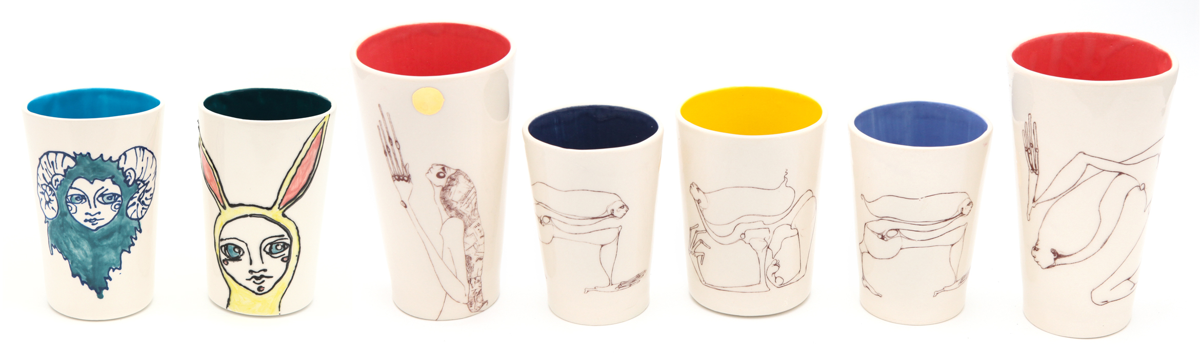 Image transfer cups from line drawings. Some have 24kt gold glaze details.