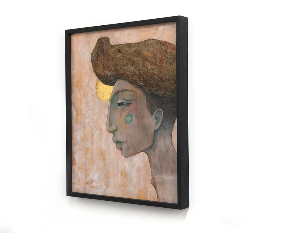 A side profile of a person with greenish skin tones, prominent cheek and chin, and high textured brown hair. They have a blue circle on their cheek and a gold crescent shape above the eye