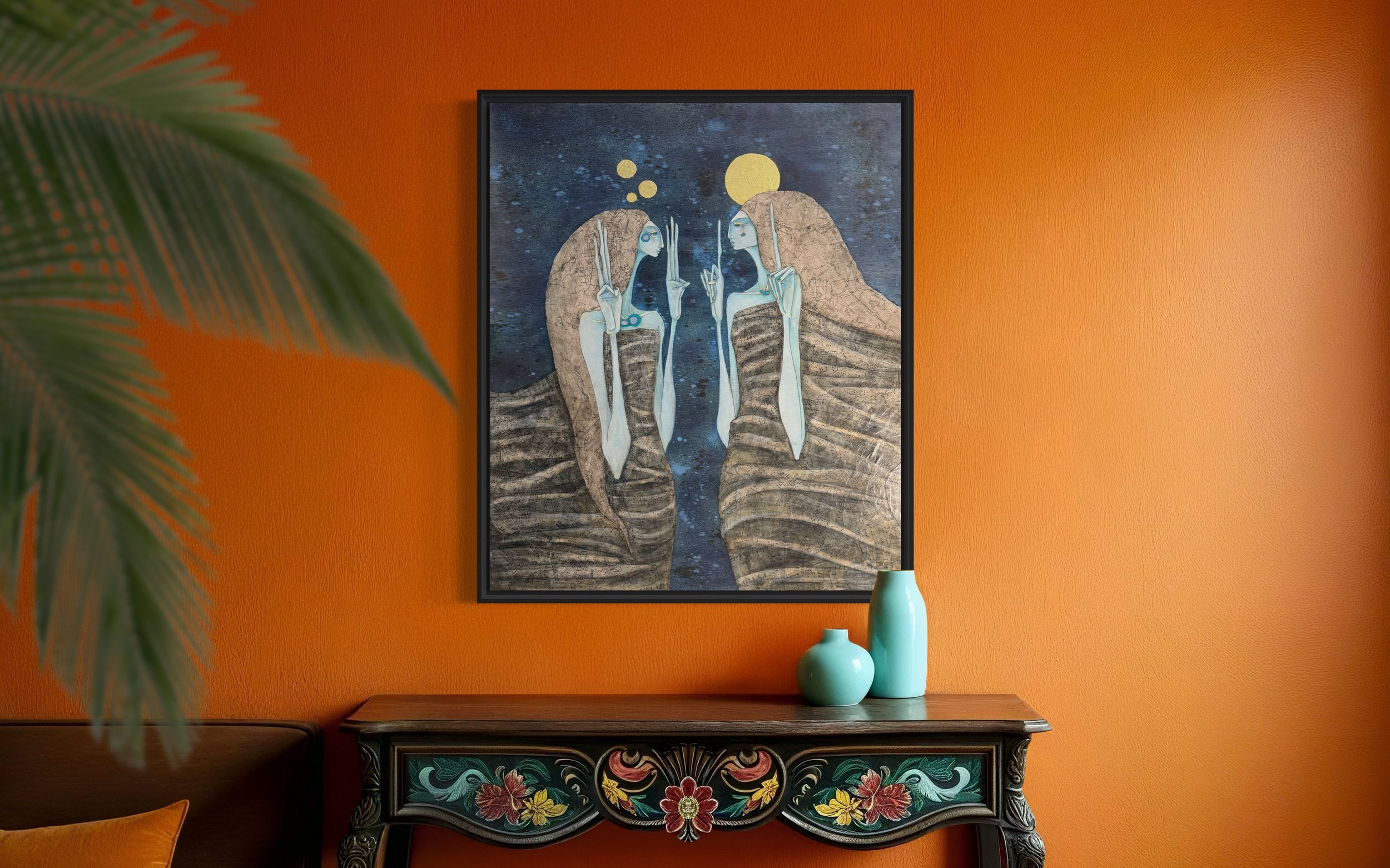 Two tall, slender, blue-skinned figures wrapped in earth-toned cloaks face each other against a dark blue, starry background. Features collaged sheet music & maps layered with ink wash and gold leaf