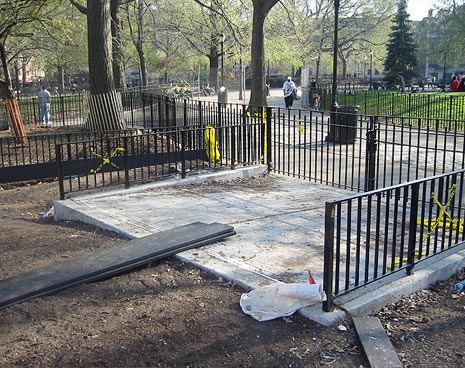 The service entrance was a requirement to bring trucks into the run for maintenance. The fences on either side are creating narrow corridors so they are being removed. A new drinking fountain will be installed here plus a second swimming pool for the dogs during summer months.