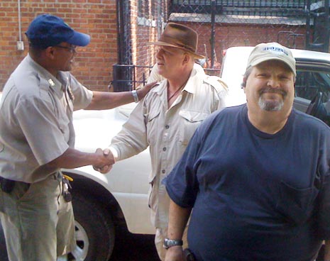 Tompkins Square's new manager Duval Drumond (left) shakes hands with District Manager Mike McLean (center), and retiring manager Harry Greenberg (right)