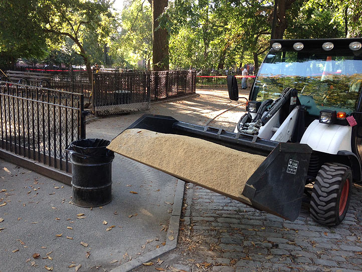 The bobcat and operator hired by Friends of First Run from park user donations begins moving the new stone into the service gate