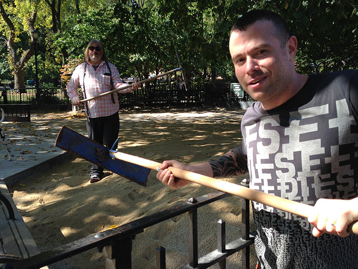 Darren (Scrappy & Tokyo) and Greg (Brody & Boots) help shovel the sand over the fence