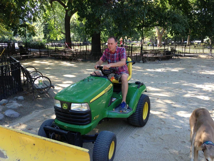 We use a tractor to grade and spread the sand in the large dog run