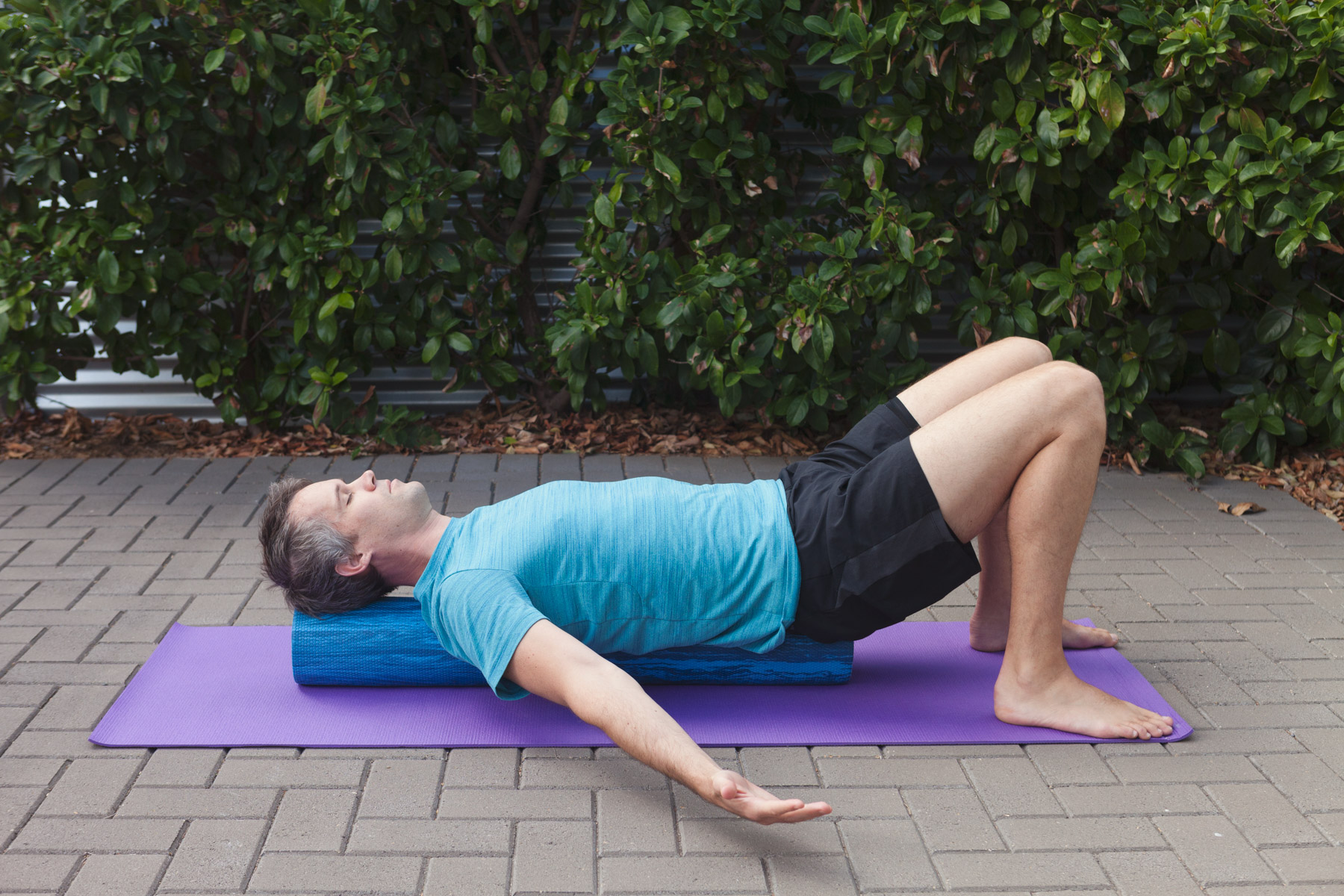 Pecs stretch with breathing Bring your awareness to your neutral spine. You should have a slight arch in your lower back (about 1 fingers width). Maintain this position while you breath in and slowly bring your arms out to the side and up over your head, feeling a gentle stretch in the front of the shoulders.