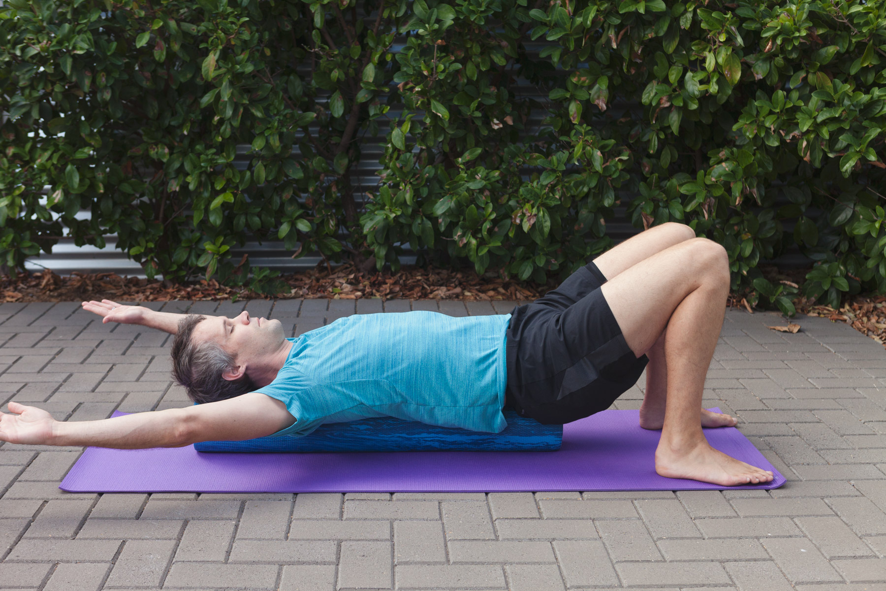 As you breathe out, lower the arms down, whilst maintaining neutral spine.