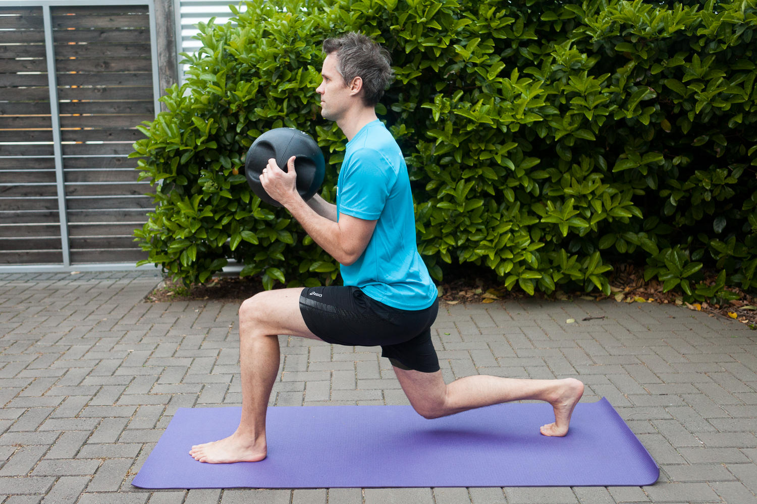 Progression: Reverse Lunge with medicine ball