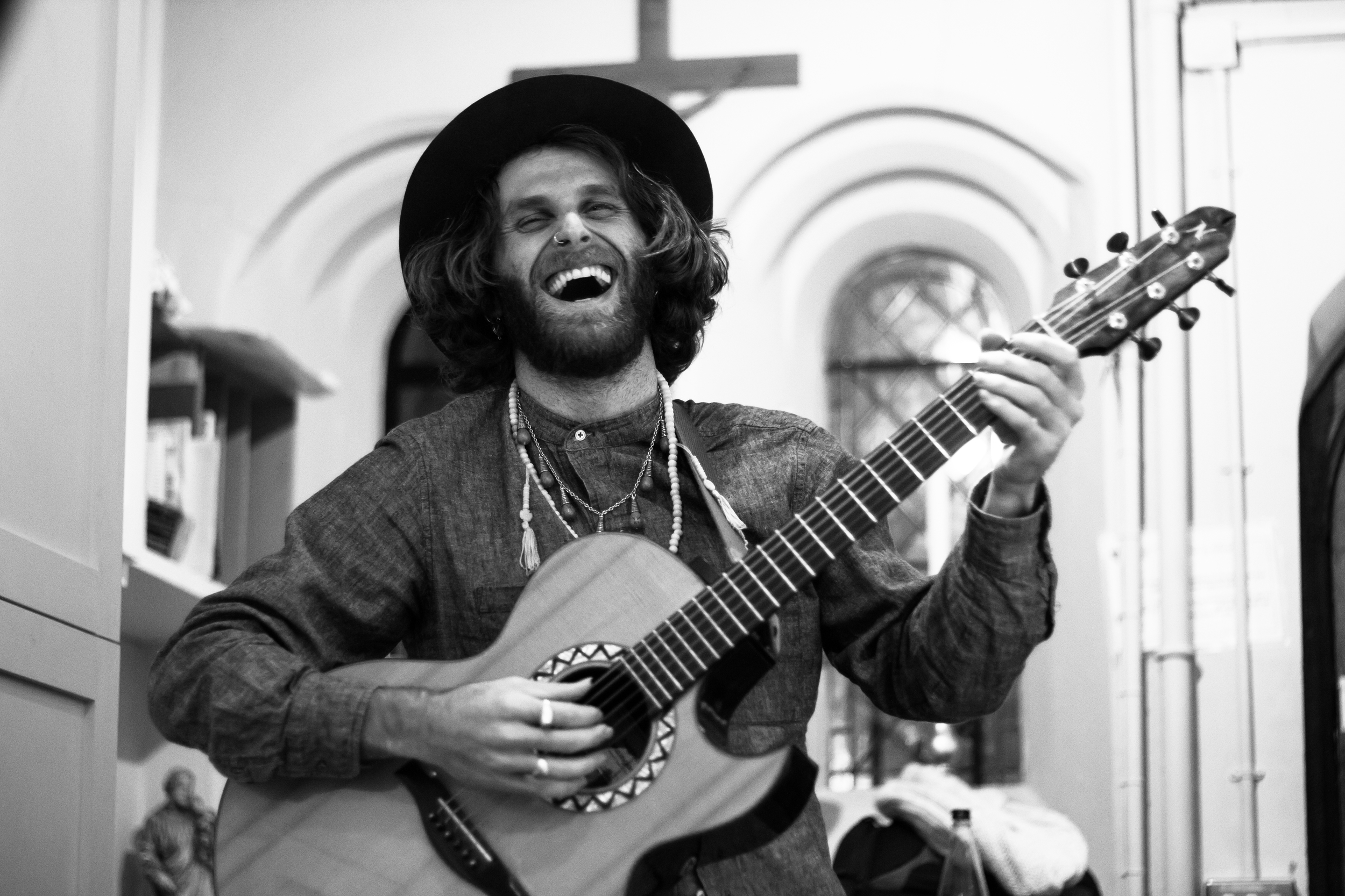 Nate Maingard, backstage, warming up with his guitar "Melody"
