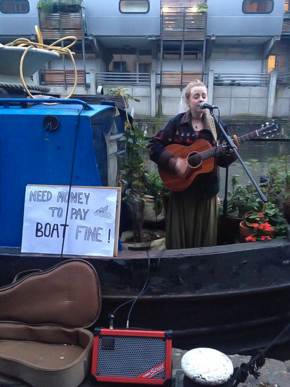  Ny Oh and her boatmates got fined for mooring illegally. They payed the whole fine by busking