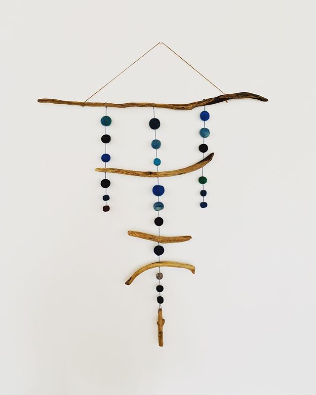 I helped my daughters kindergarten class felt some wool balls and then I assembled them into a couple wall hangings with some collected driftwood for their upcoming school auction. We had so much fun and Rae became so attached to them I think I am go