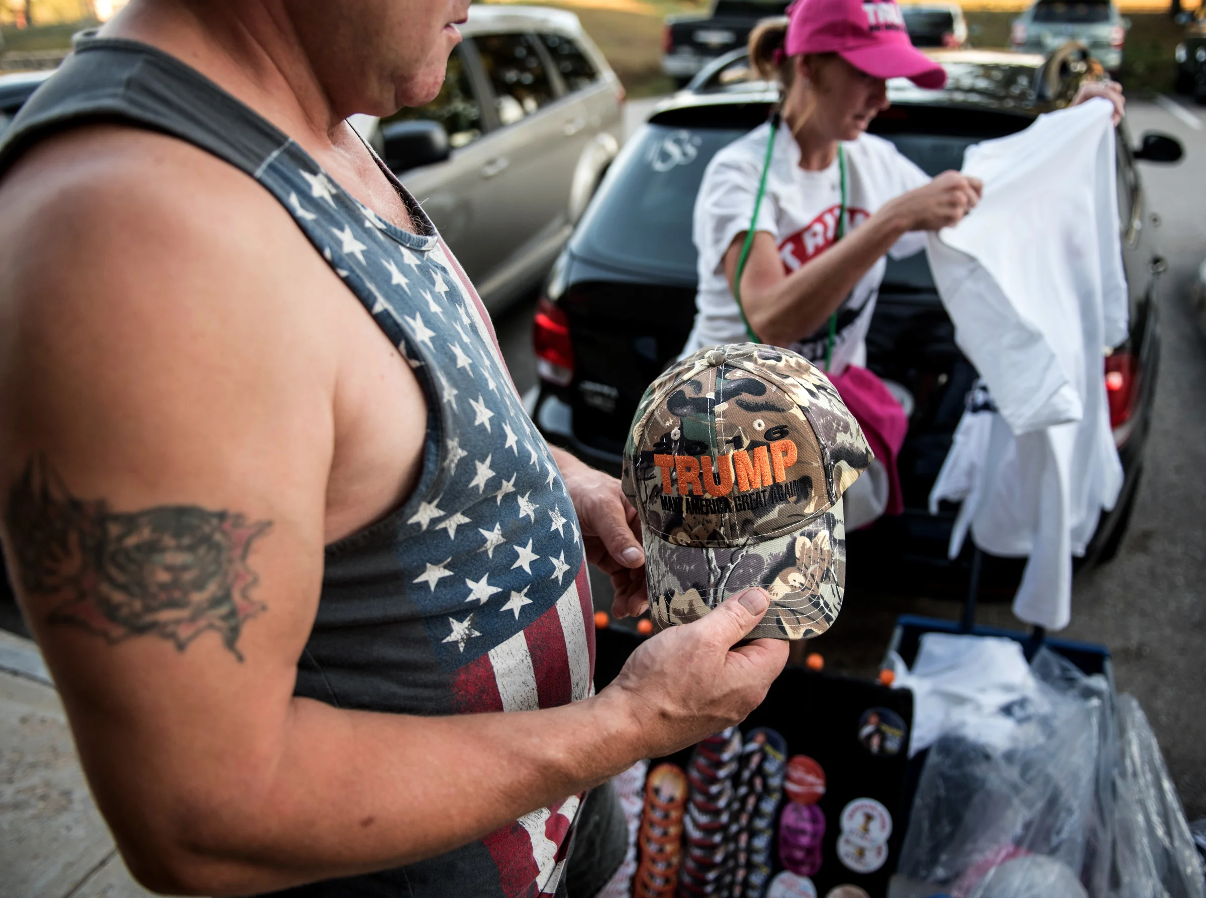 Trump merchandise sells briskly before a town hall in Rochester, New Hampshire. The vendors have been traveling alongside the campaign since his appearance in Arizona. 
