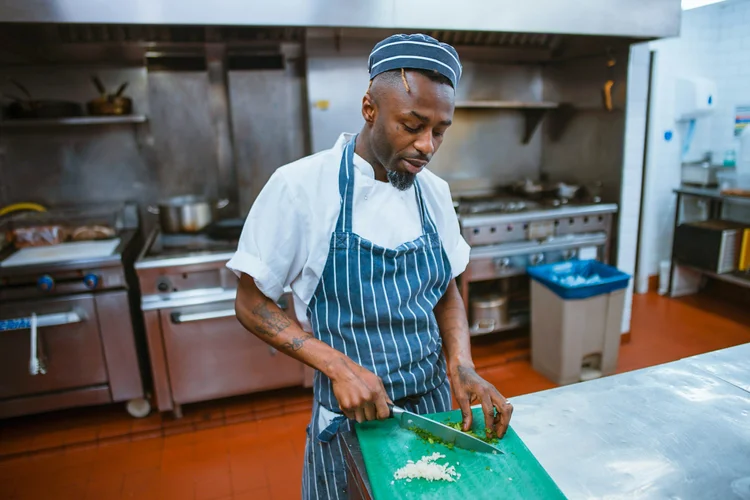 Behind the scenes brand photography showing a business owner at work