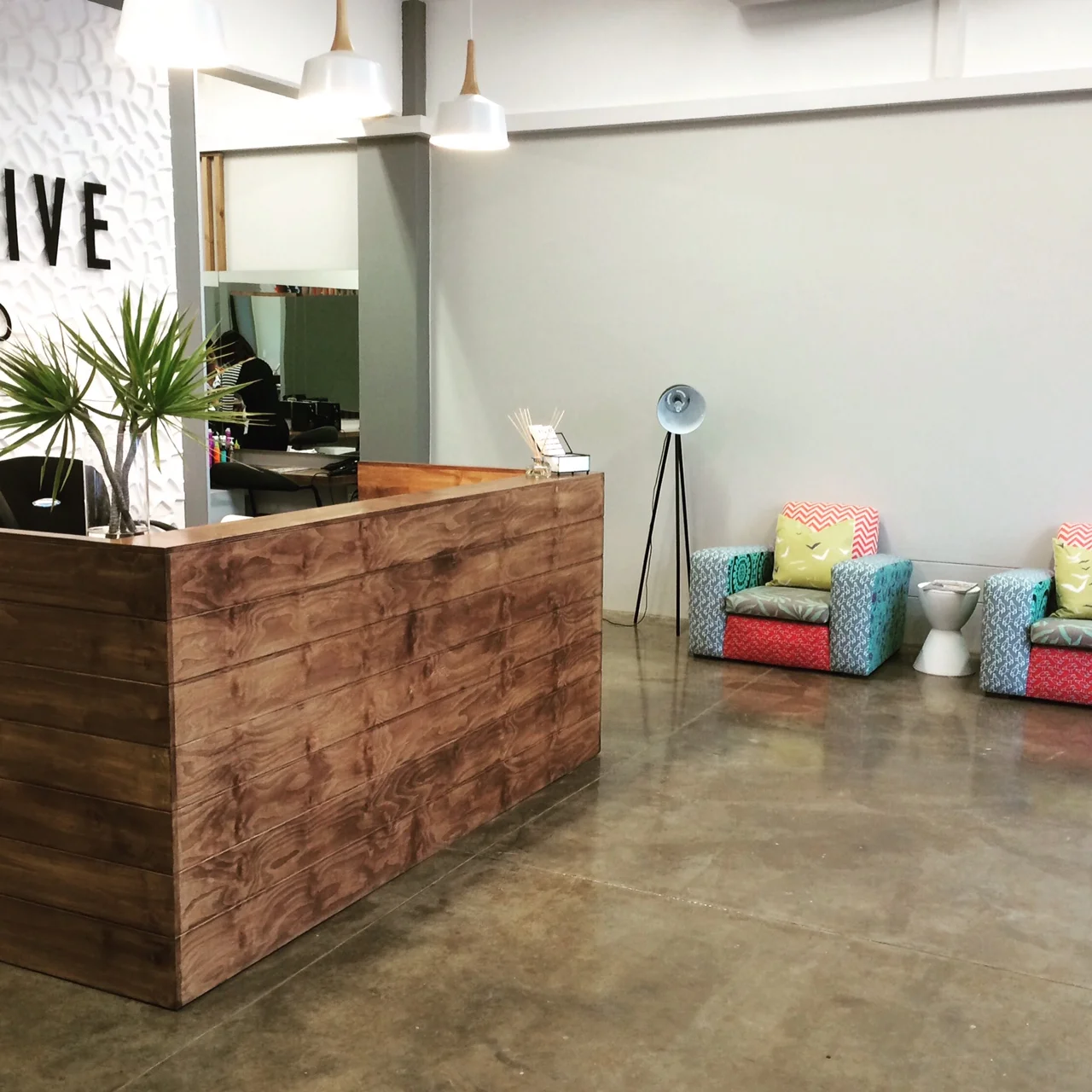 Reception area with patch-work chairs.