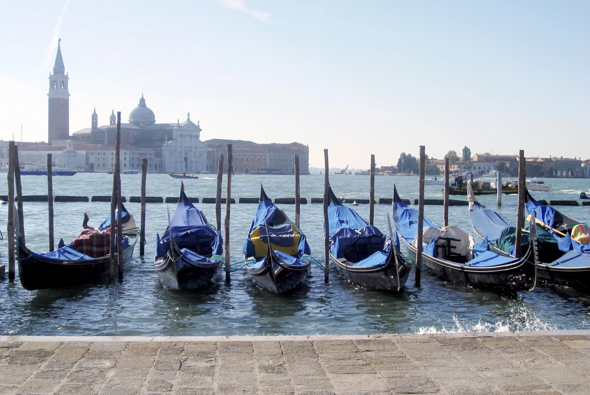 Gondolas in Venice with Murano in the back