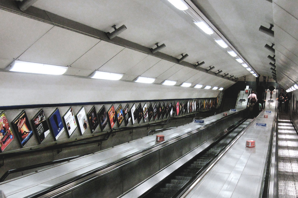 An escalator down to The Tube in London