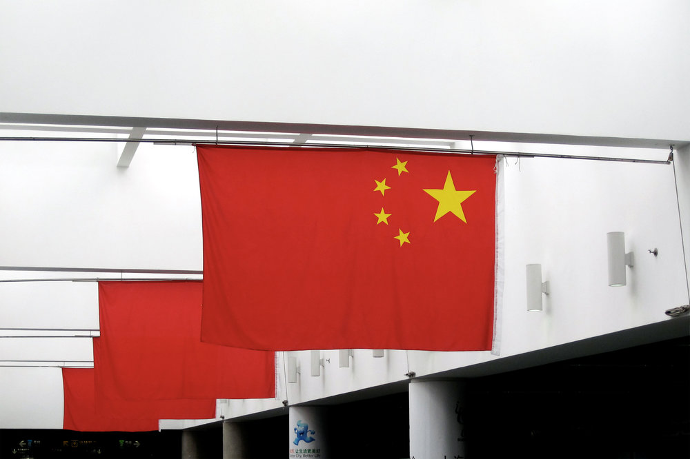 Chinese flags in a subway station