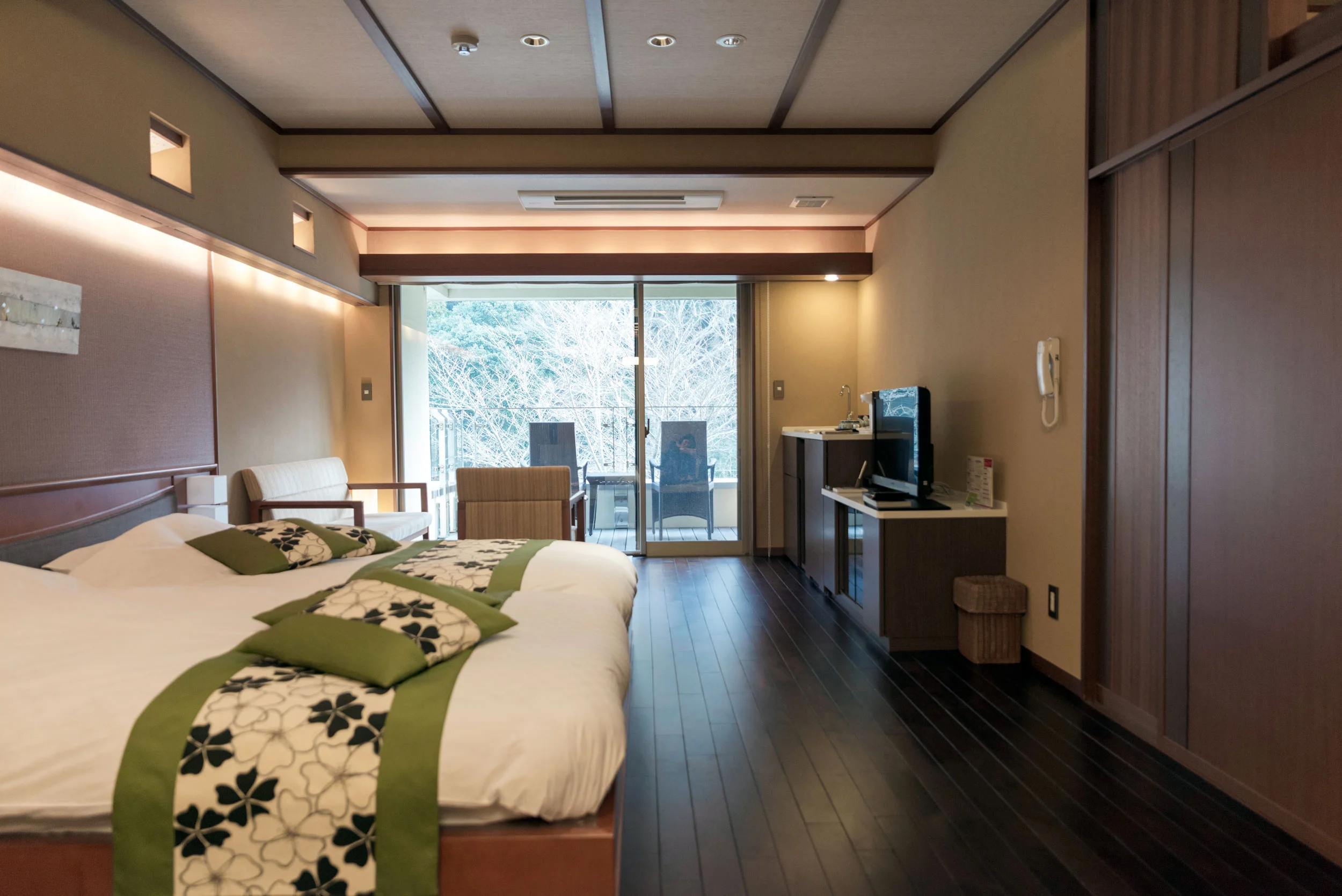 Main room with a balcony out in front and a tatami room behind