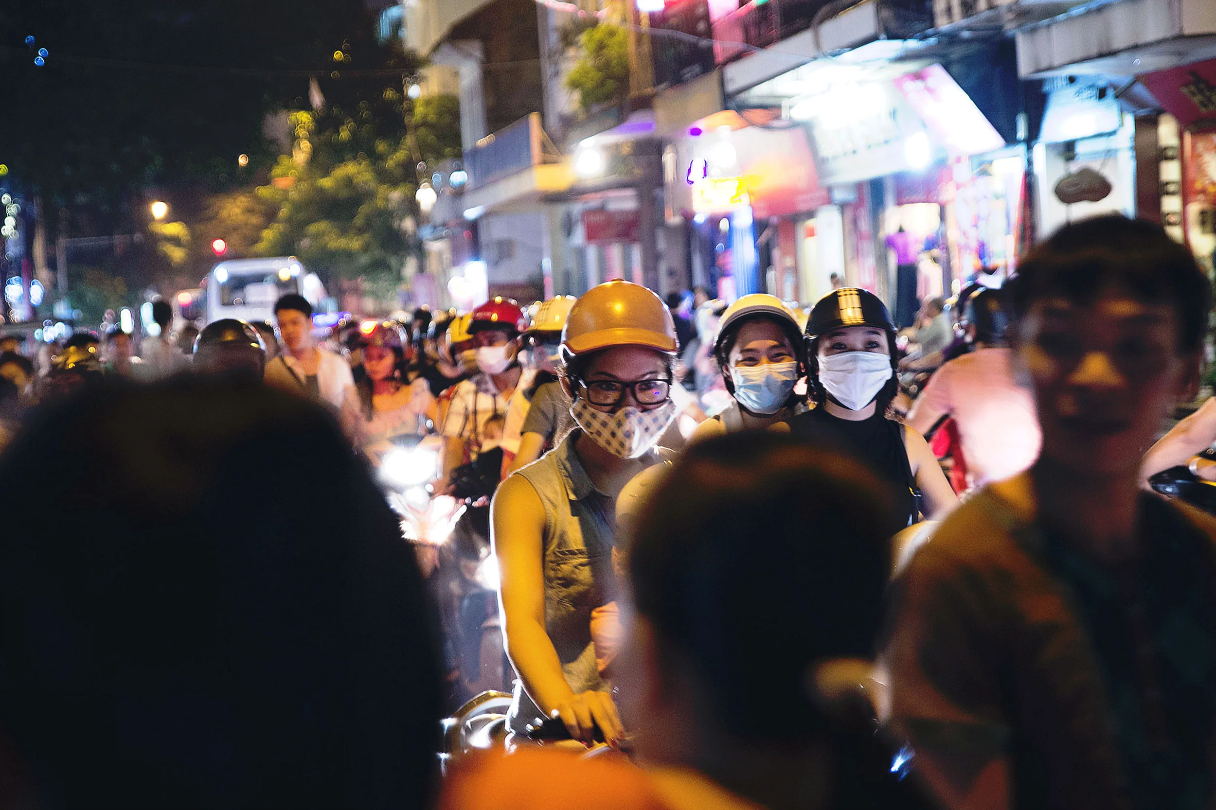 People are stuck in traffic on their mopeds in Hanoi