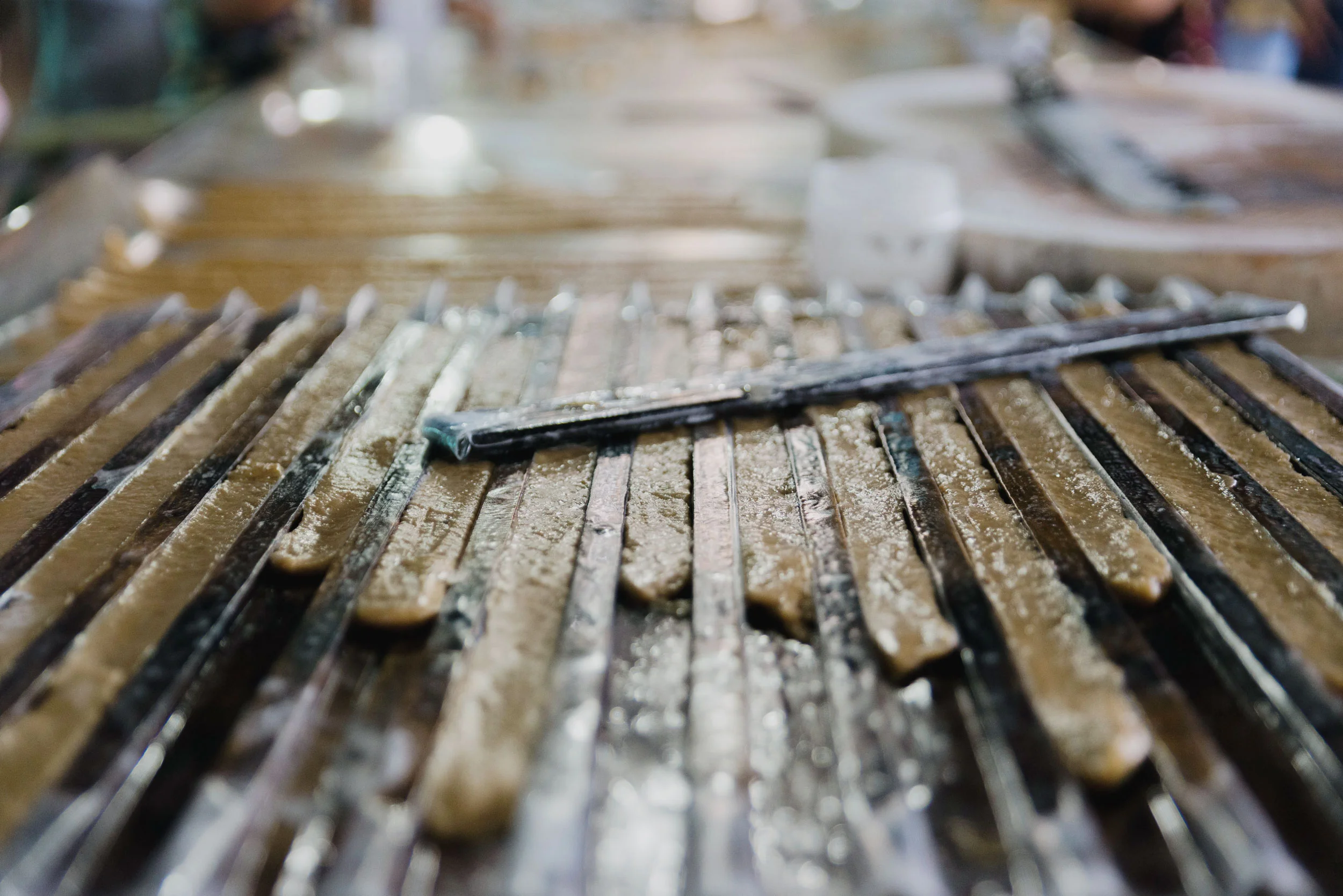 Coconut candy being dried at a candy maker along the Mekong river