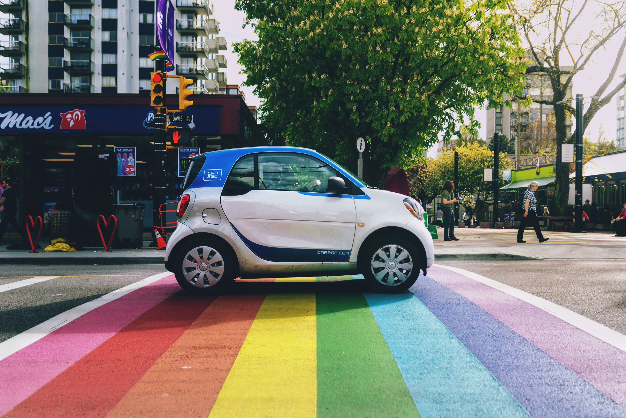 A car2go drives through Davie Village