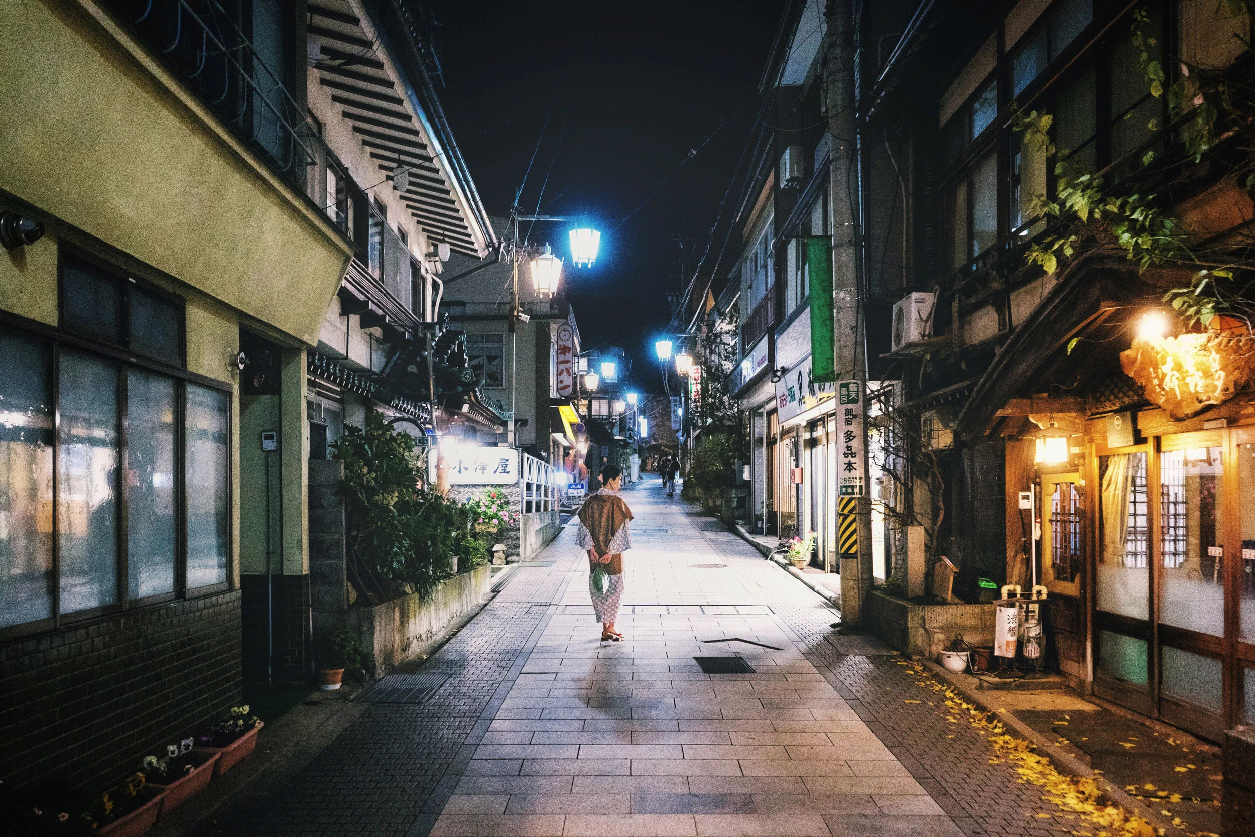 A woman walks through the streets of Shibu Onsen in Yamanouchi.