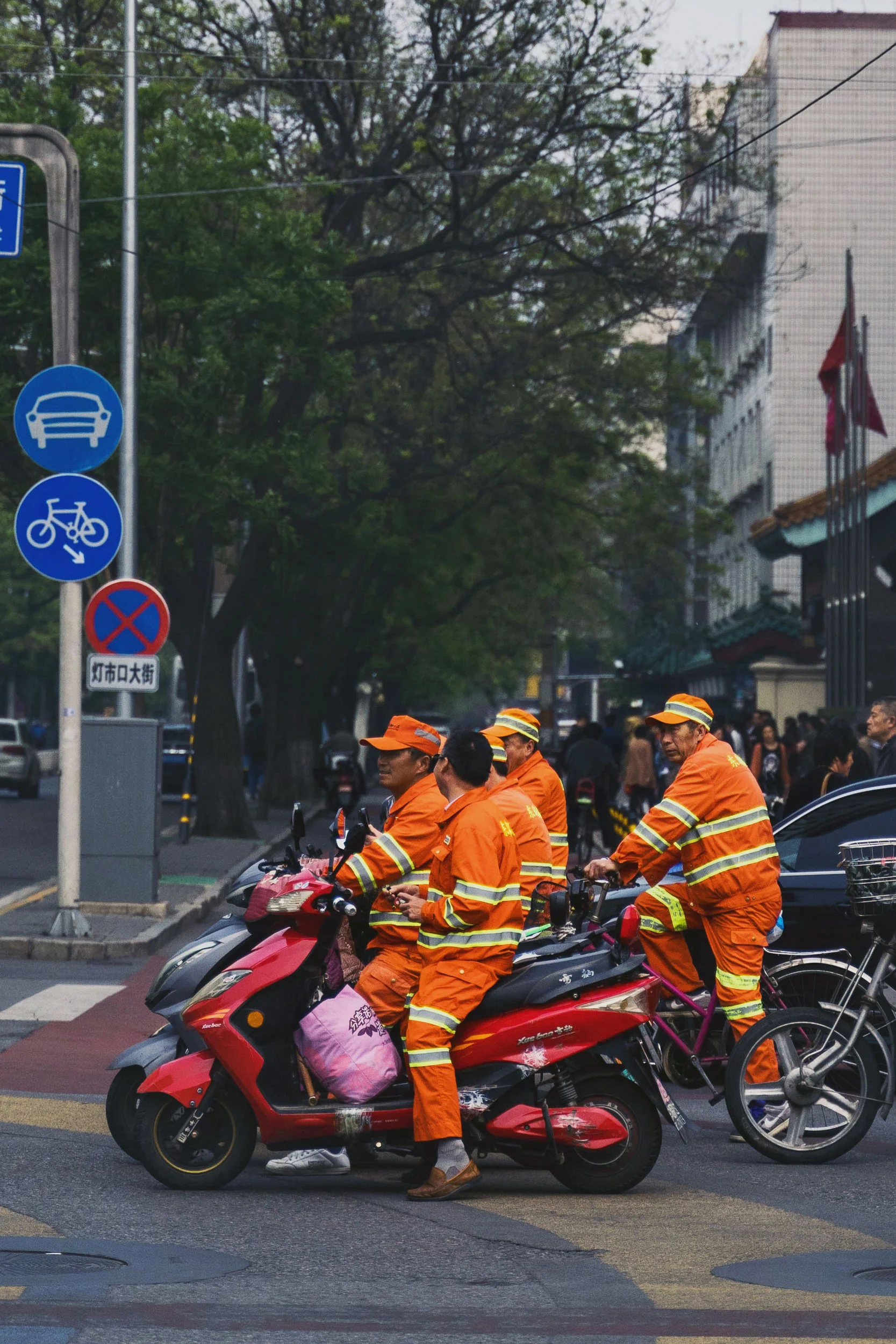 Some workers stop at a traffic light on the way home.