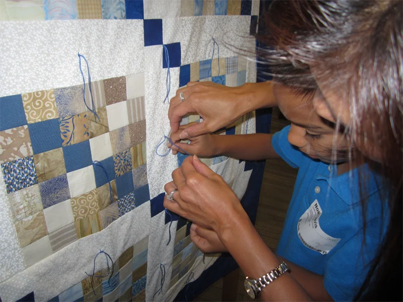 Mom and son Tie a Knot, Say a Prayer as part of the Prayer Quilt Ministry