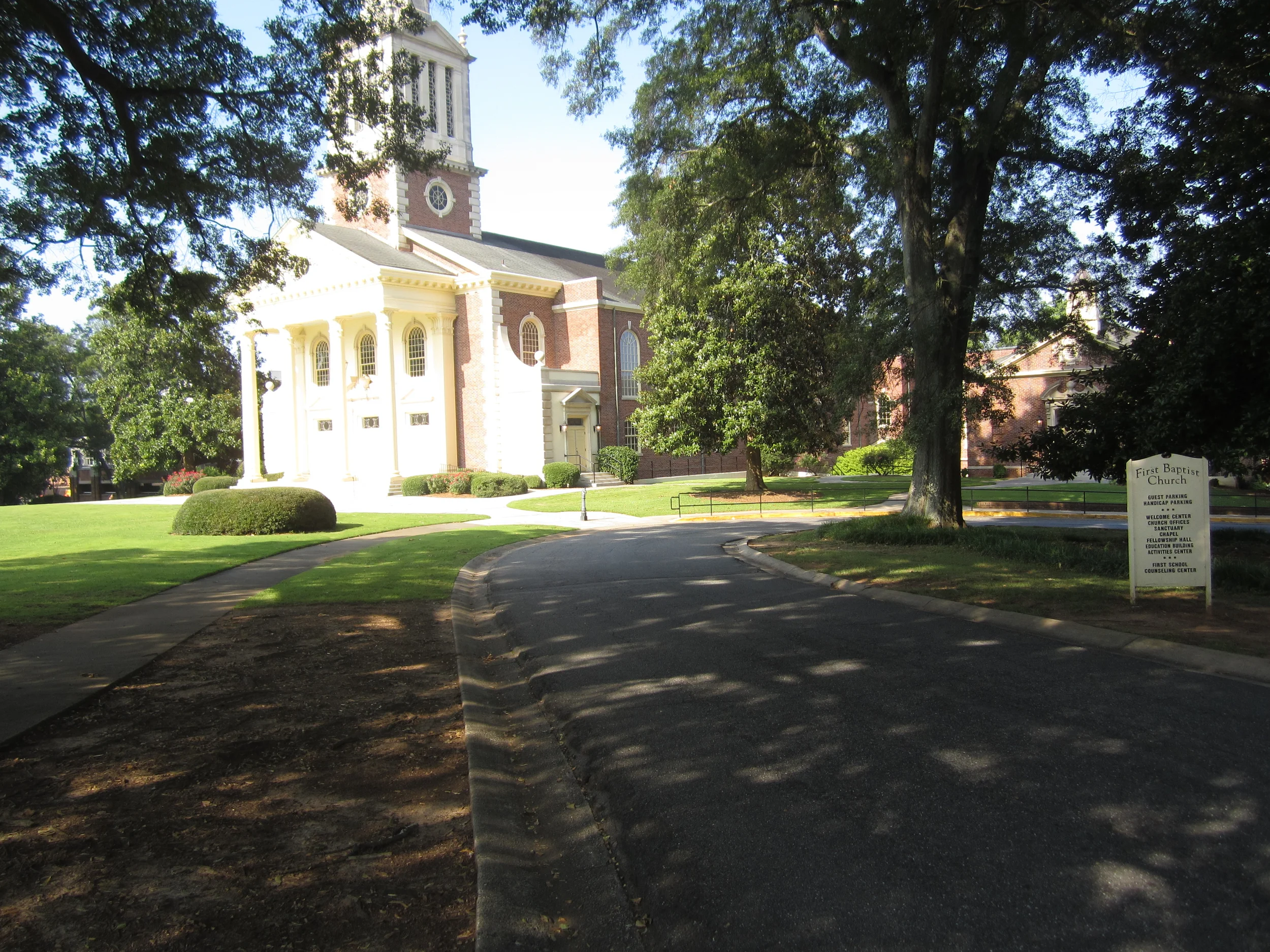 The driveway to the right of the Sanctuary curves by the Chapel and into the outside parking area.