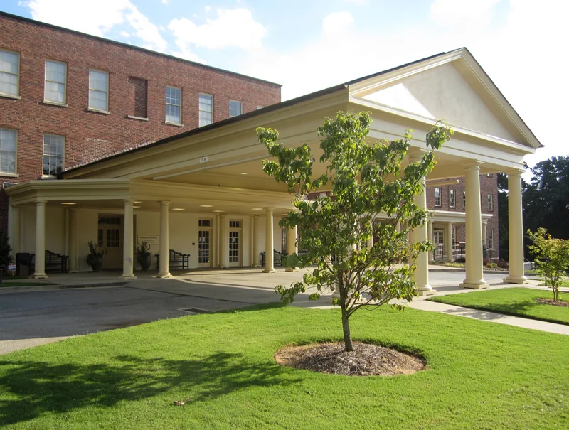 At the portico, enter the Welcome Center.