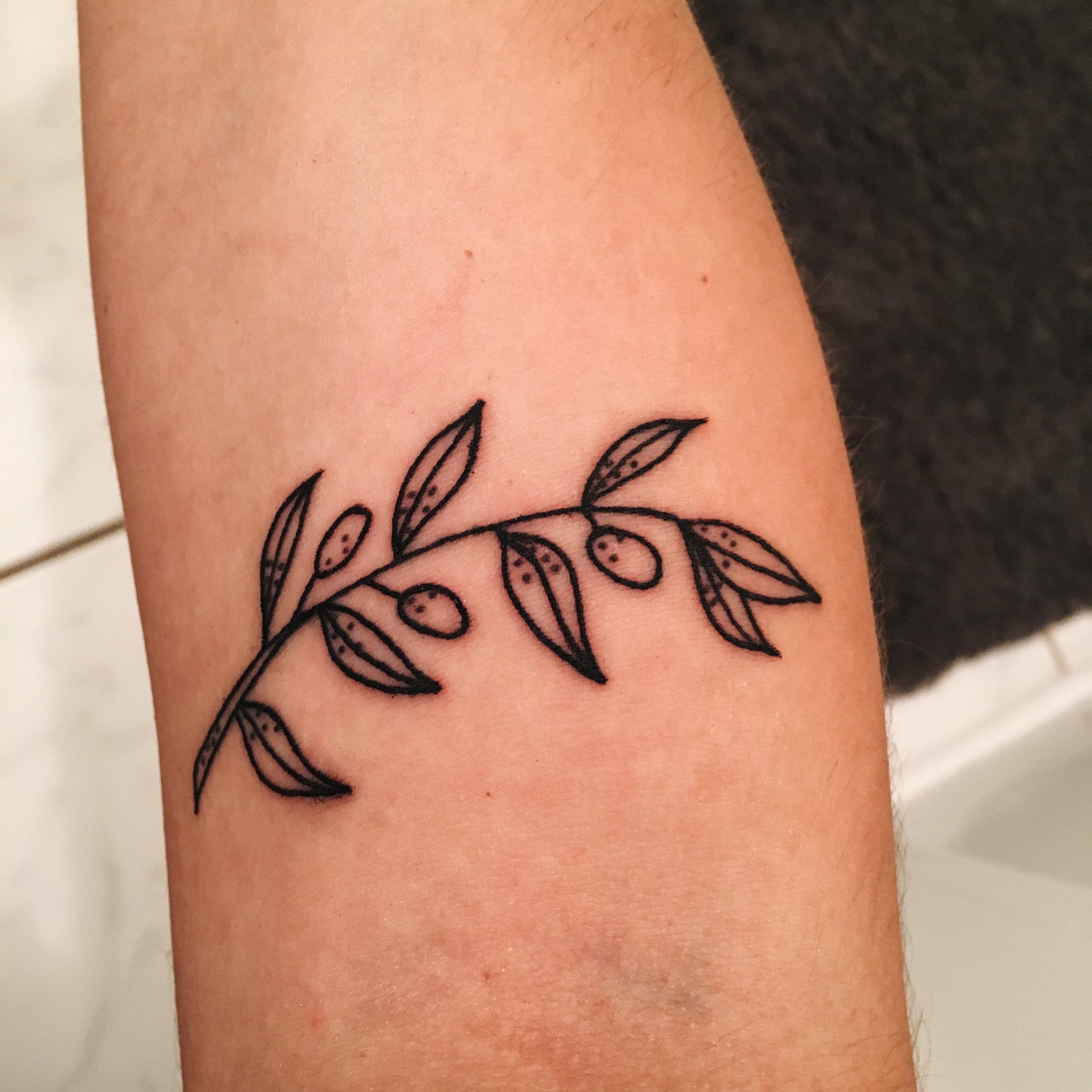 What does an olive branch tattoo mean