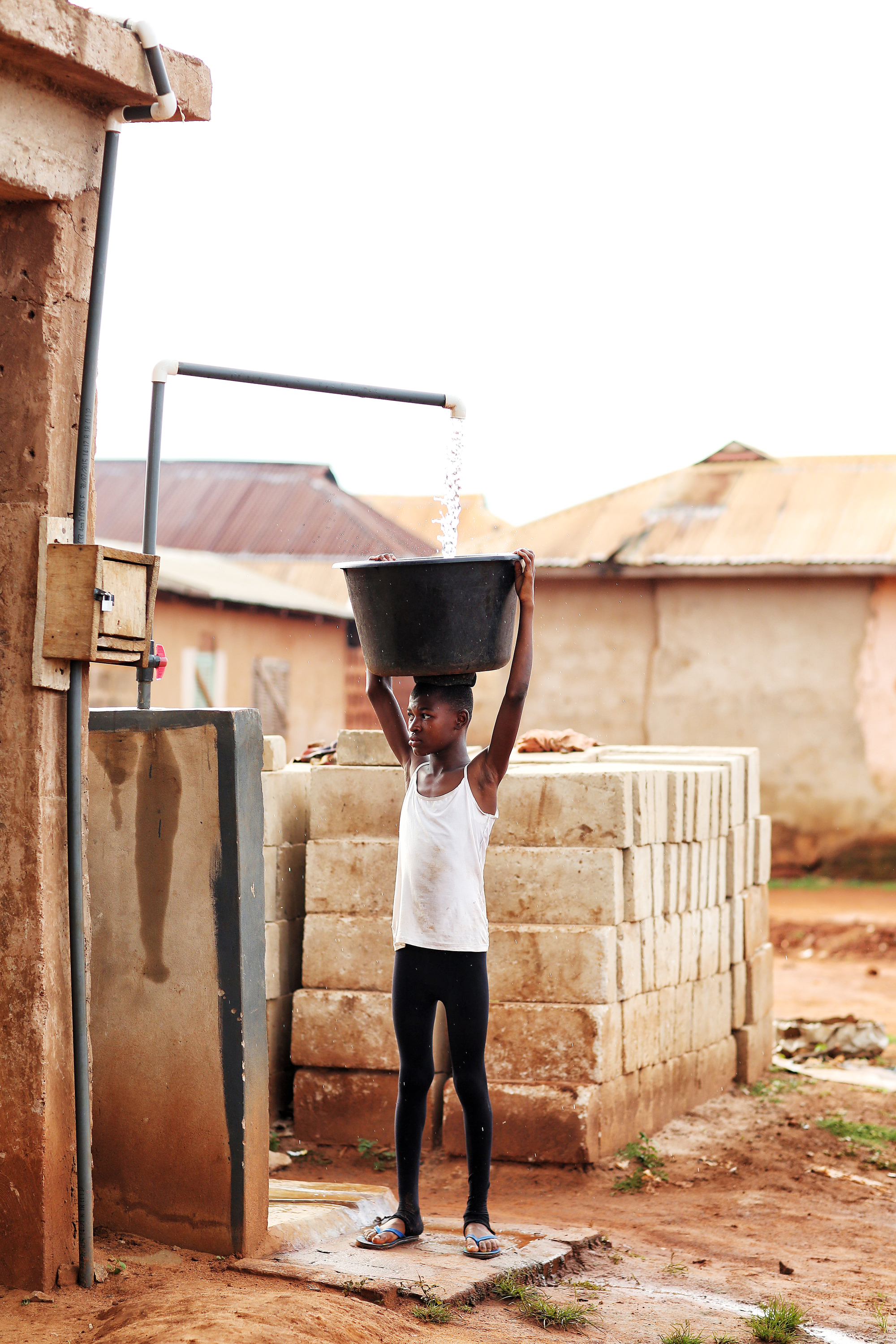  Every day after school, Patience travels to the local water source, about a quarter of a mile from their home. 