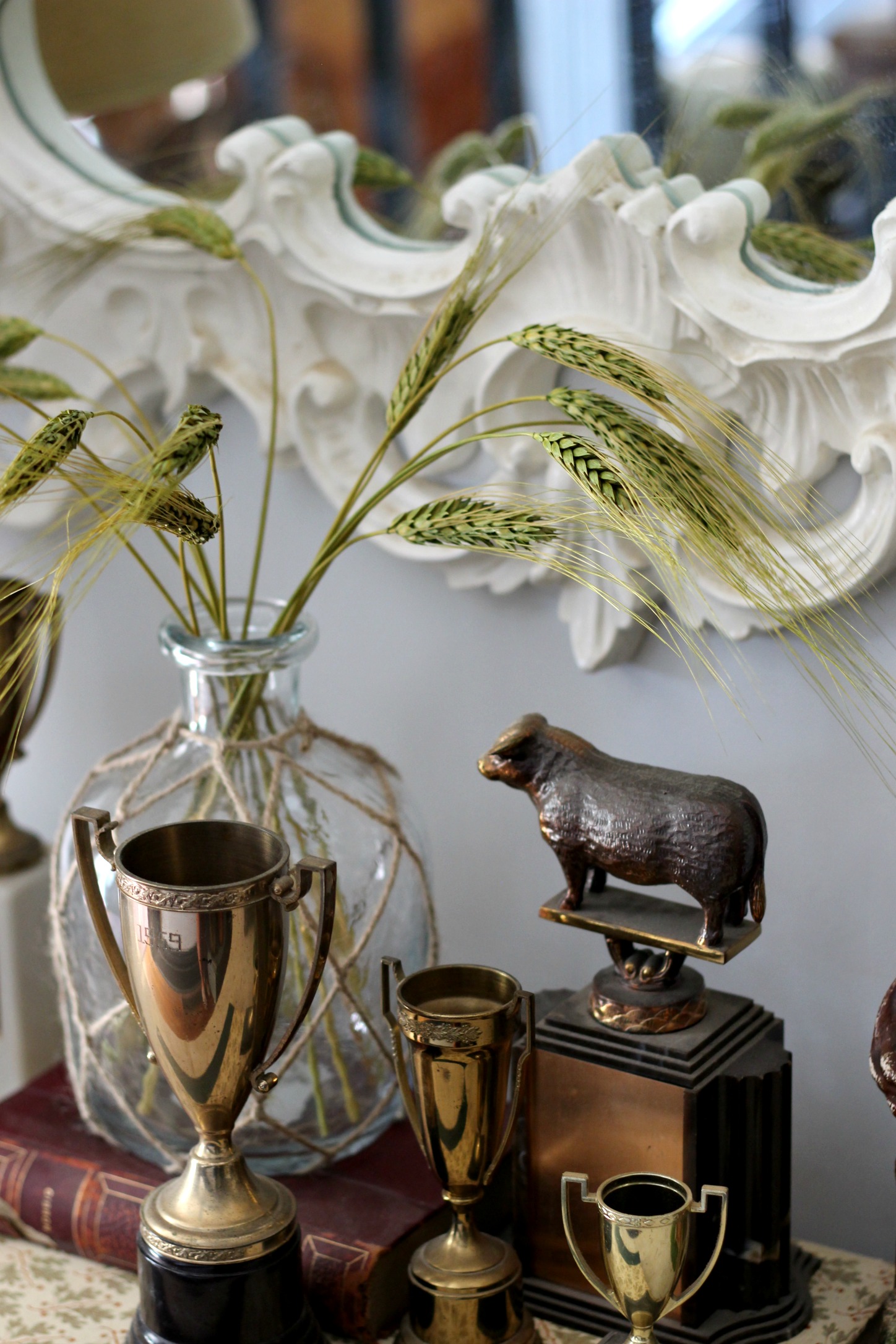 Vintage trophies + books: thrifted | Glass bottle: At Home | Straw: Hobby Lobby