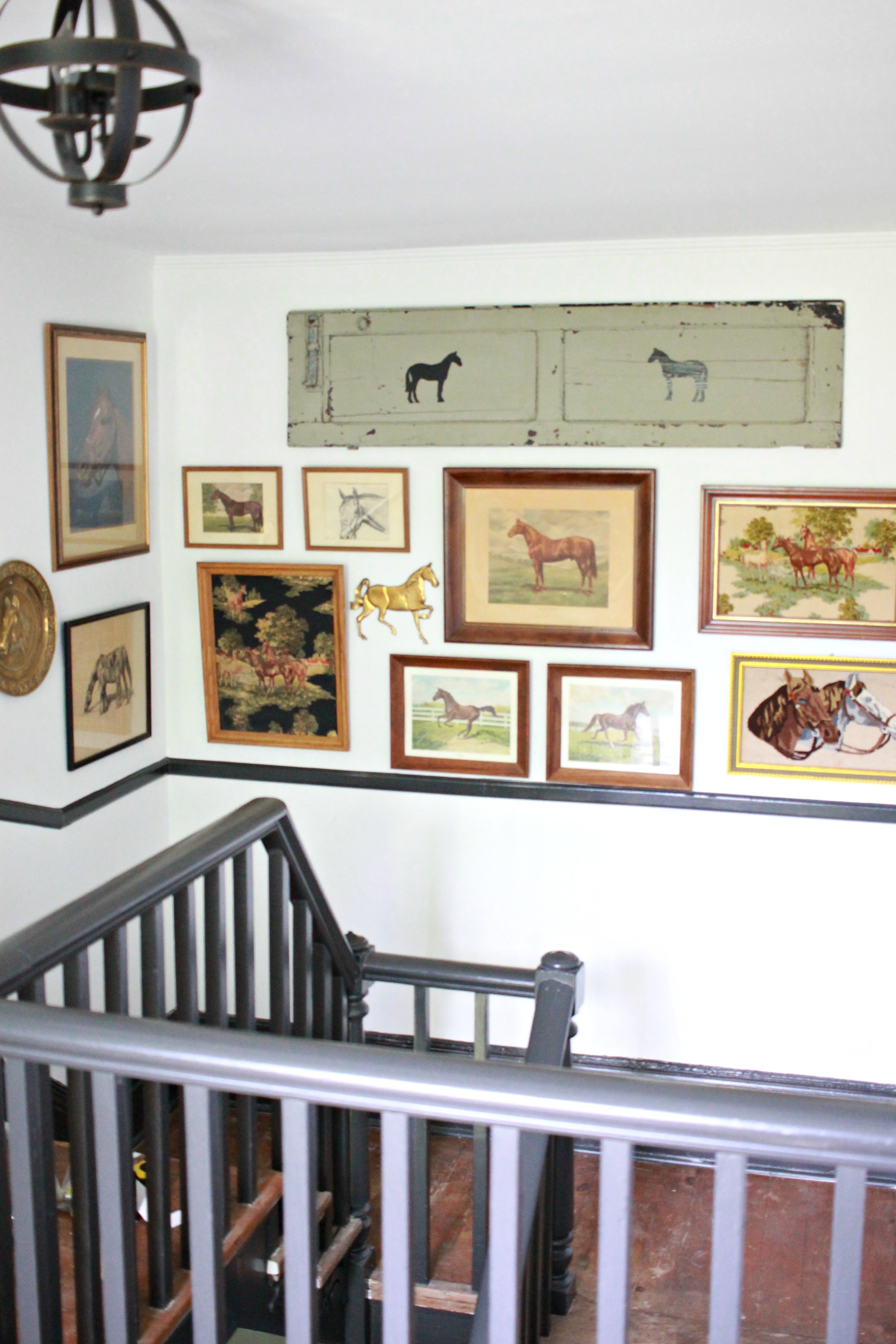 Vintage equestrian gallery wall in my home's entryway