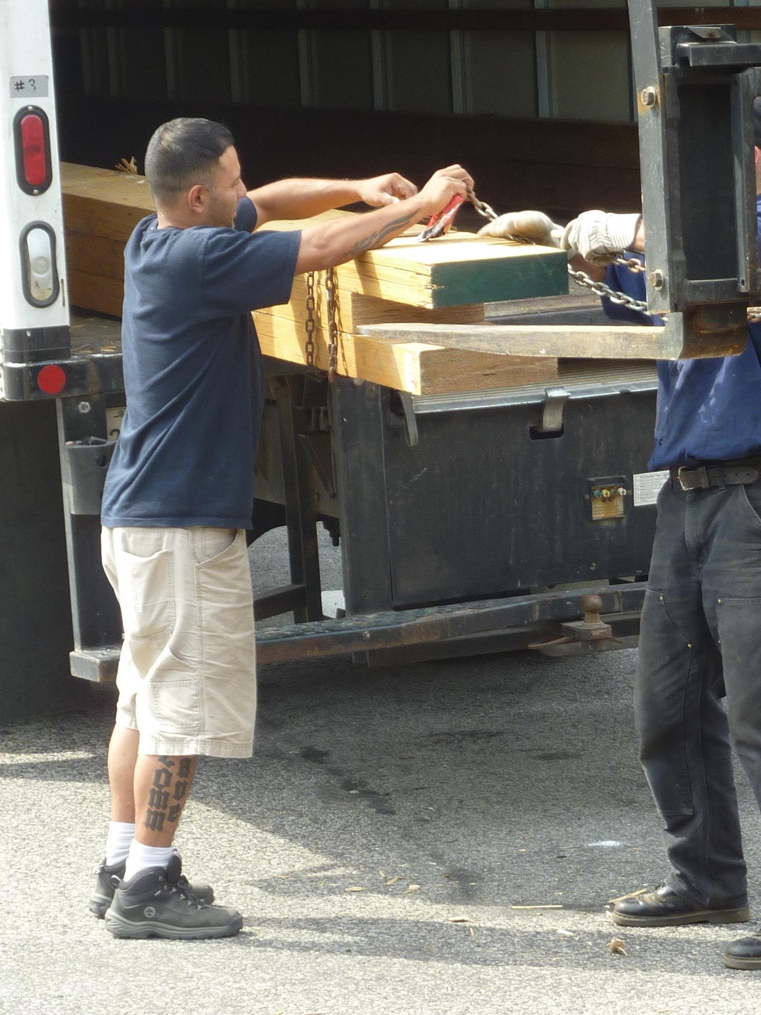 Donations staff member John Robles helps unload.